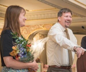 Dr. Geoff Jones of Newport Hospital and Health Services accepts the 2016 Family Physician of the Year award. Also pictured is his wife, Dr. Shannon Radke. 