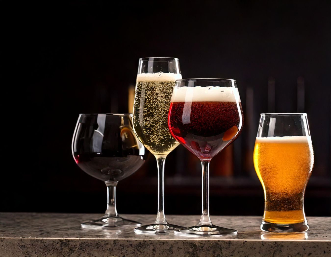 Glasses of wine and beer on a counter