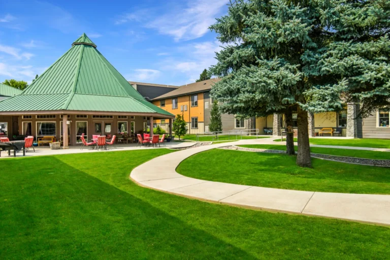 Photo of the outside of building and grounds of River Mountain Village Assisted Living