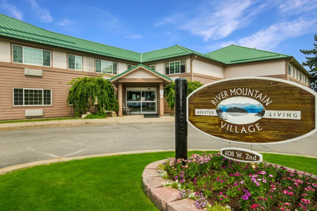 Photo of the sign and front of building of River Mountain Village Assisted Living